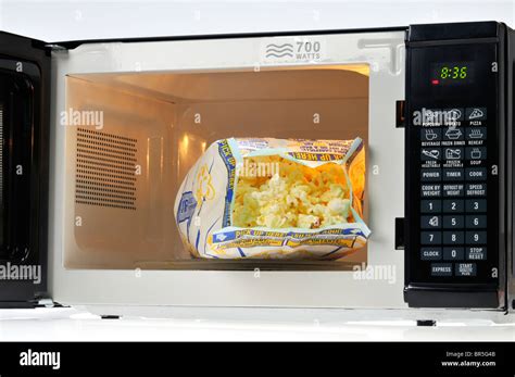 Open Bag Of Pop Secret Microwave Popcorn In Microwave Oven Usa Stock