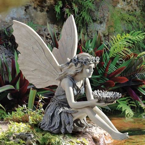 There are hundreds of fantasywire fakes all over: Fairy Statues To Create A Whimsical Garden | Fairy statues ...