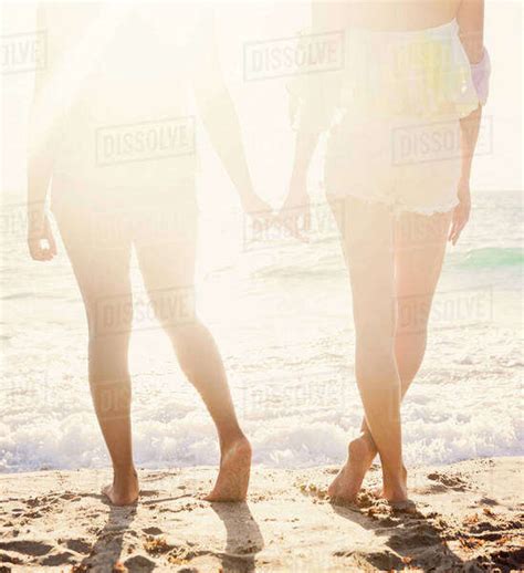 Female Friends On Beach Stock Photo Dissolve