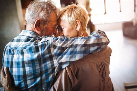 Elderly Couple In Love Senior Husband And Wife Hugging And Bonding With True Emotions Stock