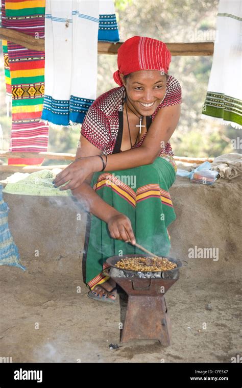 Ethiopian Woman Roasting Coffee Beans At A Coffee Stall Just Abve The