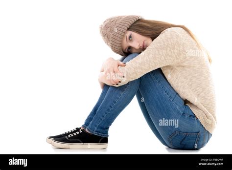 Sad Teenage Girl With Problems Sitting With Her Head On Her Knees Copy Space Stock Photo Alamy