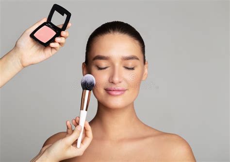 Professional Makeup Artist Apply Blush On Woman Cheeks Stock Photo