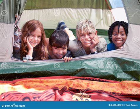 We Love Camping Four Friends Lying In A Tent Together And Smiling