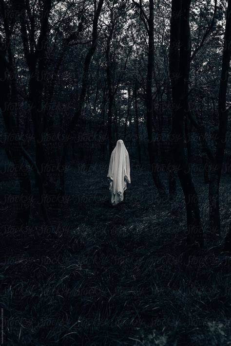 Halloween Ghost In A Dark Forest By Stocksy Contributor Nata A