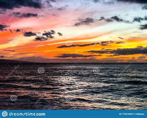 Sunset Dark Clouds Over Pacific Ocean Island Stock Image