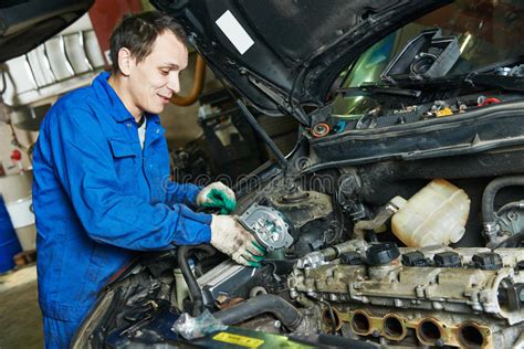Mechanic Repairing And Polishing Car Headlight Stock Photo Image Of