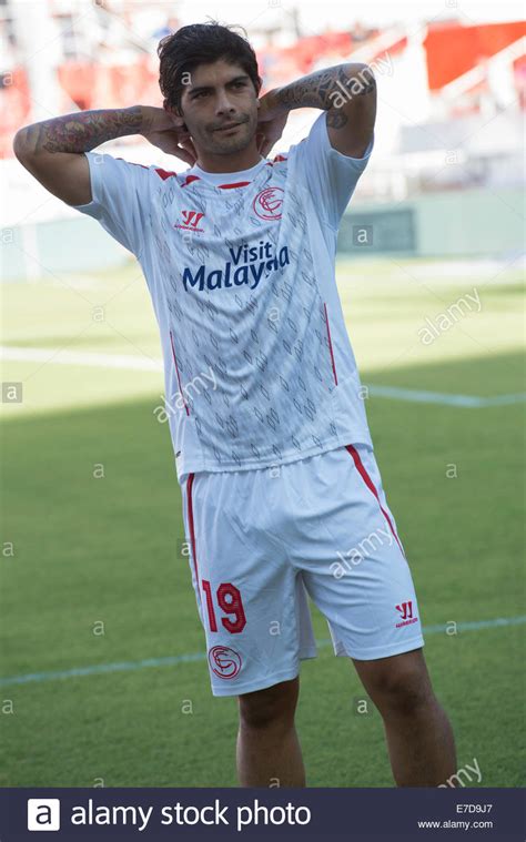 Maybe you would like to learn more about one of these? Seville, Spain, September 14, 2014: Sevilla FC player ...