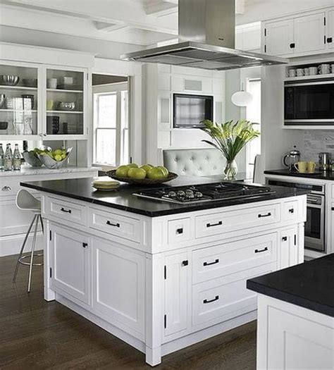 Related:black kitchen cabinet handles pack black kitchen cabinet hinges black kitchen cabinet knobs. vintage inspired white cabinets and a large kitchen island in the center with black countertops ...