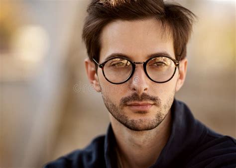 Portrait Of A Guy With Glasses Posing Outdoors Stock Photo Image Of