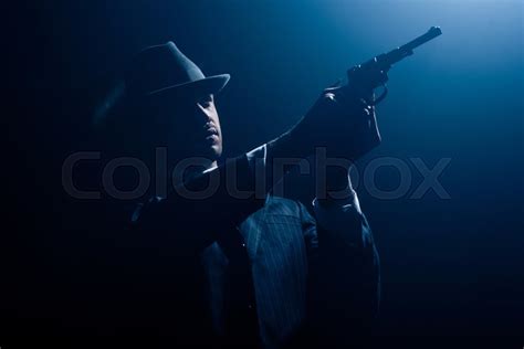 Gangster With Outstretched Hands Aiming Stock Image Colourbox