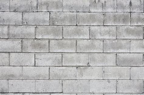 Mounting putty is especially good for cinder block walls because it is thick enough to fill in cinder block's bumpy surface. DIY Cinder Block Retaining Walls With Rebar and Concrete ...