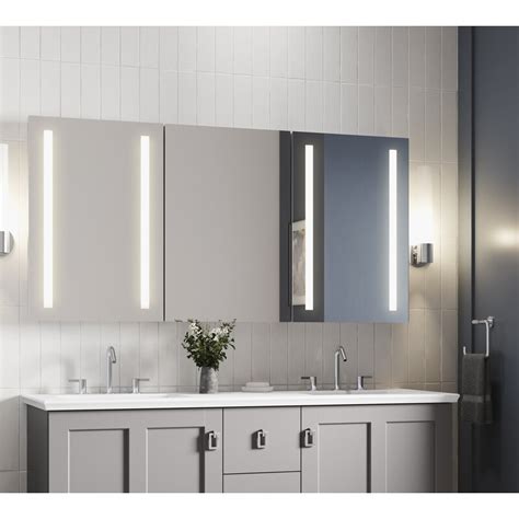 The cabinet door(s) features both sides mirrored and opens to reveal a mirrored cabinet with adjustable glass. Kohler Verdera 60W X 30H Lighted Medicine Cabinet | Wayfair