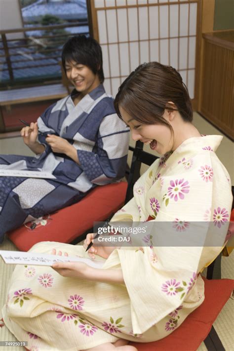 Young Couple In Yukata Writing Japanese Poem Side View Japan High Res
