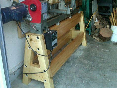 a machine that is sitting on top of a wooden stand in a room with other