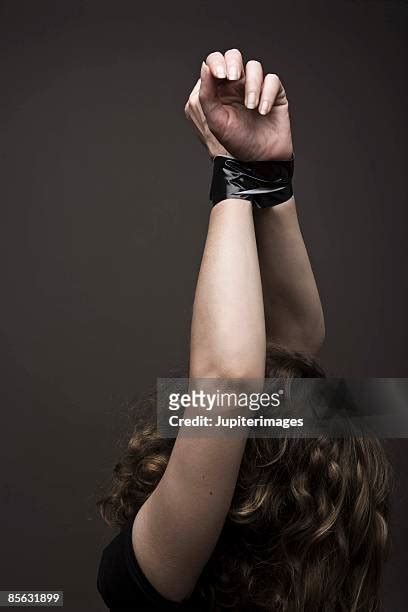 tied wrists photos and premium high res pictures getty images