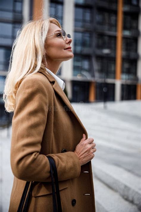 Dreamy Blonde Lady In Eyeglasses Standing Outdoors Stock Image Image