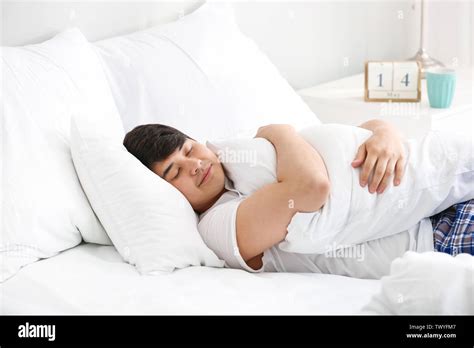 Handsome Young Man Sleeping In Bed Stock Photo Alamy