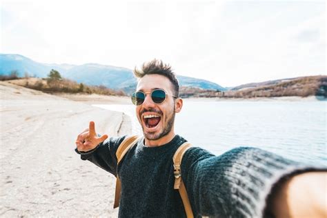 Premium Photo Handsome Man With Backpack Taking Selfie Outdoor Young