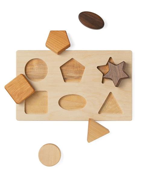 We love the simplicity of this natural wood shape sorting ...