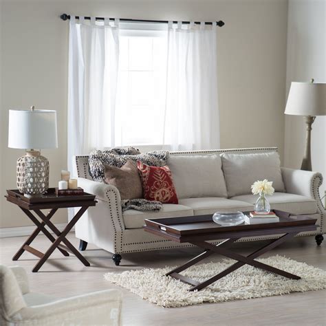 Scale is an important consideration and just as a coffee table that's too tall can overpower your sofa, one that's too long can overwhelm your sofa and impede movement throughout the room. Belham Living Regan Coffee Table with Tray | www.hayneedle ...