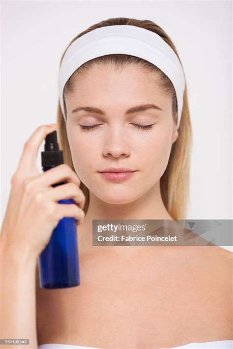 Beautiful Woman Spraying Water On Her Face High Res Stock Photo Getty