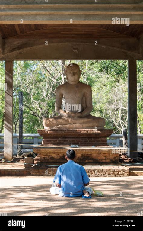 Man Meditates In Front Of Samadhi Buddha Statue Anuradhapura Sri