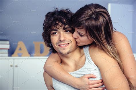 Beautiful Woman Kissing And Embracing To Happy Man High Quality