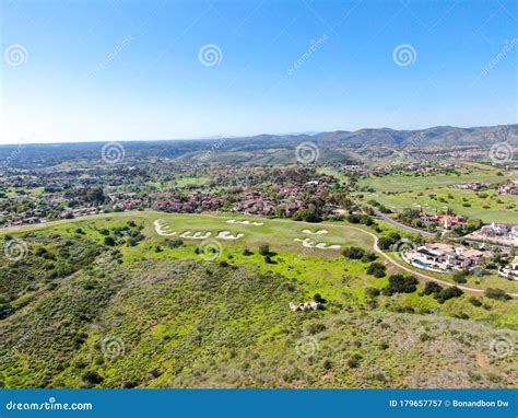 Aerial View Of Green Valley With Big Luxury Villa On The Background In