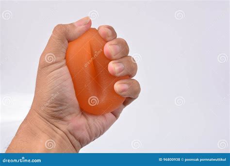 Hands Of A Man Squeezing A Stress Ball Stock Photo Image Of Ball