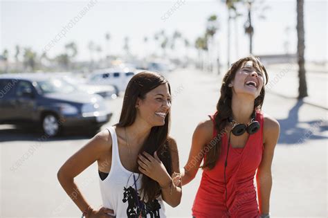 Laughing Women Walking Outdoors Stock Image F Science Photo Library