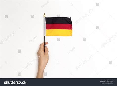 Person Holding German Flag On White Stock Photo Edit Now 1249173064