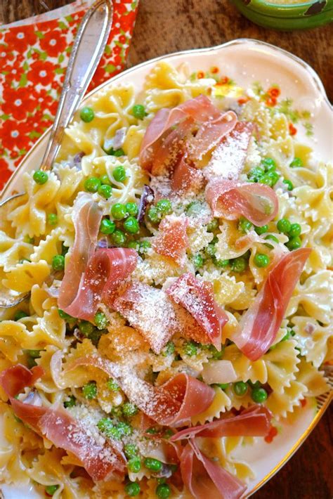 Farfalle With Peas And Prosciutto Top With Grated Parmesan And Fresh