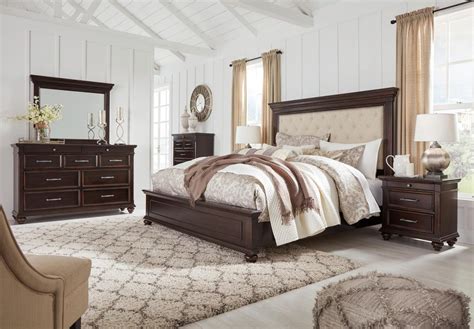 Queen and king bedroom furniture sets, expertly designed and crafted for luxurious comfort, include the bed, nightstand and dresser with mirror. Brynhurst 4pc Upholstered Panel Bedroom Set in Dark Brown