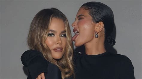 kylie jenner licks khloe kardashian s face as sisters show off thin waists in matching tight