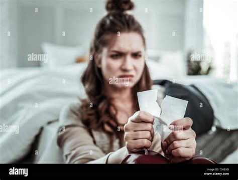 Upset Woman Breaking The Photo Of Her Ex Stock Photo Alamy