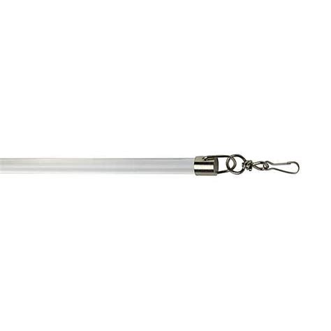 a light that is on top of a white surface with a metal hook attached to it