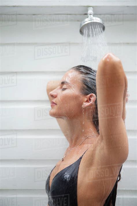 Woman Showering Outdoors Stock Photo Dissolve