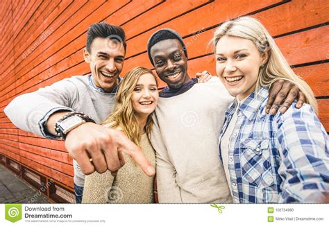 Happy Multiracial Friends Group Taking Selfie With Mobile Smart Stock