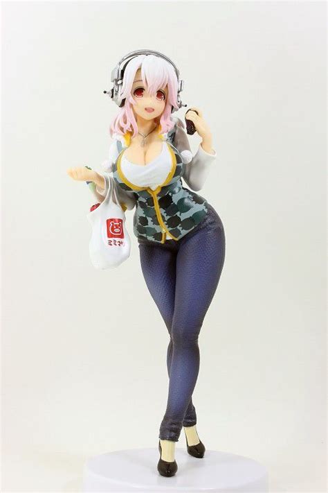 A Figurine With Headphones On Is Posed For The Camera And Has Pink Hair