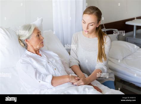 Daughter Visiting Her Senior Mother At Hospital Stock Photo Alamy