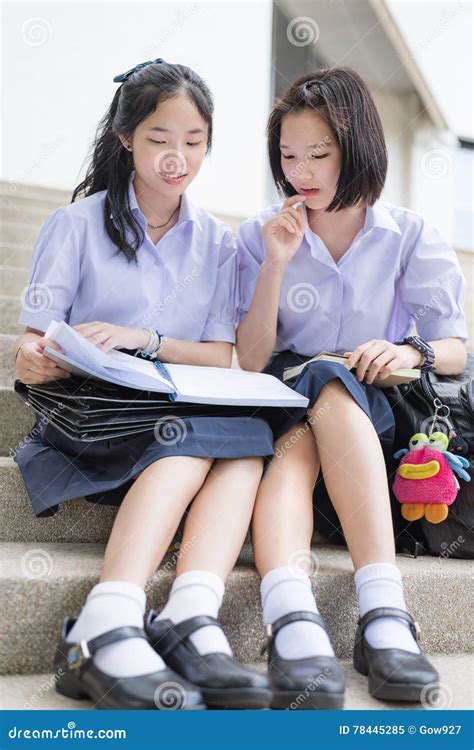 Cute Asian Thai High Schoolgirls Student Couple Reading In School Stock