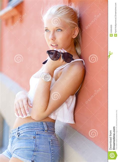 Beautiful Teenage Girl Leans Against The Wall Stock Image