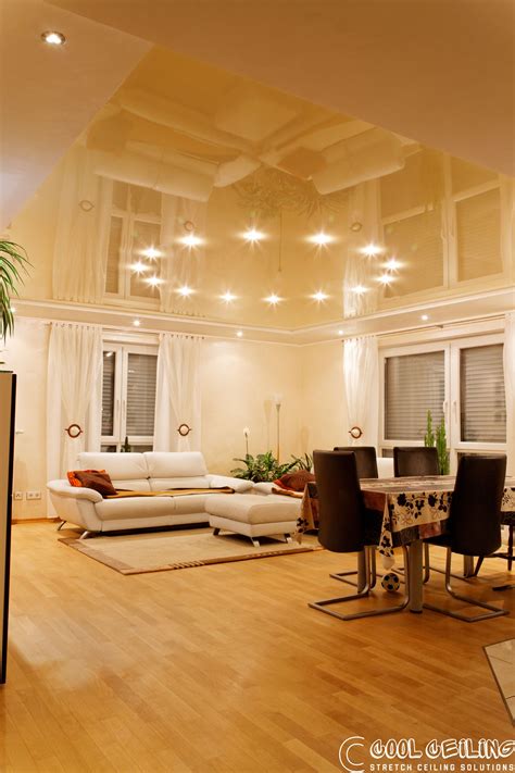 Just wipe the surface with a damp soapy sponge. Cream glossy stretch ceiling with a round recessed led ...