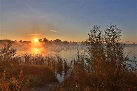 Early Morning Sunrise Over The Lake Stock Image Image Of Misty