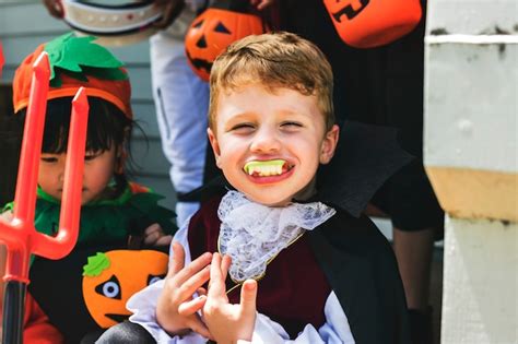 Premium Photo Little Children Trick Or Treating On Halloween
