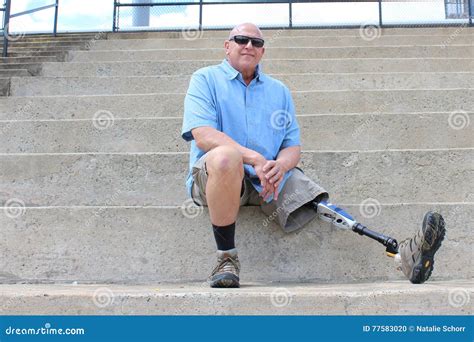 Seated Man With Prosthetic Leg Outstretched Stock Photo Image Of