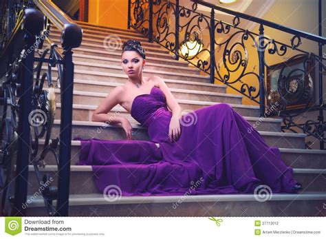 Woman In A Long Dress Is Sitting On The Stairs Download From Over 27