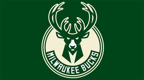 The Milwaukee Bucks Logo Is Shown On A Dark Green Background With White