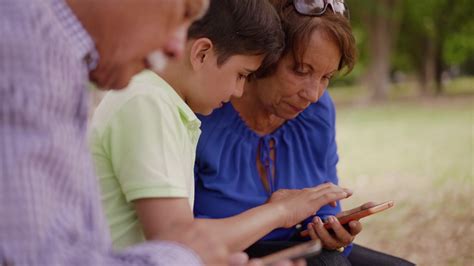 14-Child Helping Grandma Text Messaging On Mobile Phone ...
